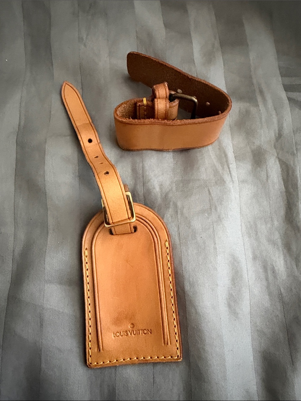 Louis Vuitton luggage tag and strap holder